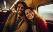 © Filip - Happy young couple sitting in the train , traveling to their vacation by train.  Active lifestyle concept