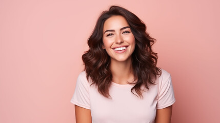 Close up of young woman with white skin, brown long hair, wavy hair and a clear rose gold orange t shirt, isolated in a light orange studio. Portrait person.