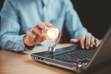 Innovative digital solution technology concept. Brainstorm creativity, idea thinking. Businessman use computer with light bulb icon. Knowledge inspiration for online technology. Innovation concept