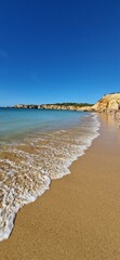 Canvas Print - Sunny day at the beach with gentle waves