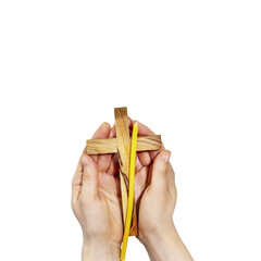 Wall Mural - Isolated female hands hold wooden crucifixion and church candle on transparent background. Concept of Easter, Holy Week, Palm Sunday, Lent and religion holidays