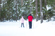 © Александр Поташев - People ski in winter on a ski track through a winter forest.Cross Country skiing.