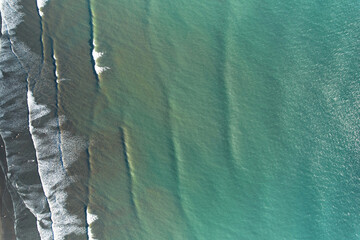 Waves on green ocean water surface