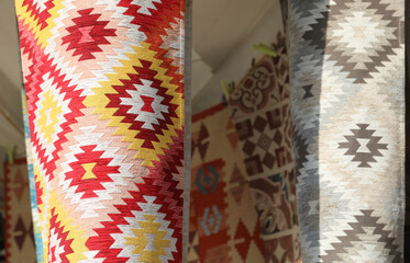 Long cotton kitchen towels with geometric patterns displayed at  market