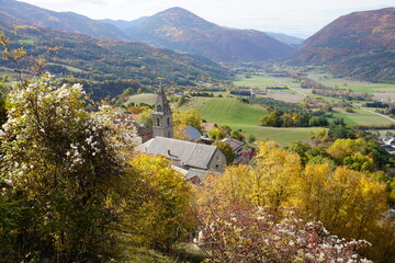 village  perched on the hill in the fall in the mountains in the southern alps, france with a view of the valley