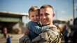 Happy young soldier returning home from the army with his child in his arms