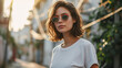 Woman white t-shirt mock up on city background, wearing green and red sunglasses 