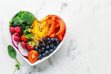 Heart shaped plate with healthy food on white background.