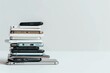 A pile of different smartphones isolated on a white background.