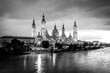 © PhotoFires - Evening landscape of the Cathedral Basilica of Our Lady of the Pillar on the banks of river Ebro in Zaragoza, Aragon, Spain with vignetting effect