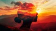 Artistic composite silhouette of a head merging with a mountainous landscape at sunset, symbolizing connection with nature