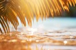 Tropical beach with palm leaf and sand on sand, shallow depth of field