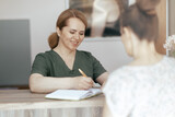 Fototapeta  - smiling female medical massage therapist in massage cabinet
