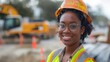 Confident Female Construction Worker with Hard Hat Smiling at Construction Site