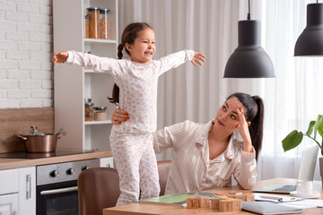 Sticker - Working mother with her naughty little daughter in kitchen