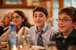 © sashka1313 - A Jewish family celebrates a Bar Mitzvah. Jews gather around the festive table to celebrate Hanukkah. a Jewish holiday, Jewish traditions