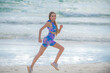 © Volodymyr - Running sexy woman jogging on beach. Fit woman doing workout on sea sand summer beach. Summer sport. Fitness female sport model jog lifestyle. The Running. Fit girl run on beach.