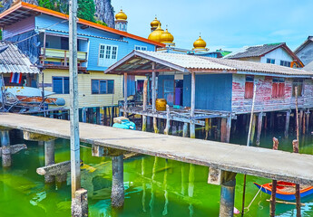 Wall Mural - The pier against old stilt houses, Ko Panyi village, Phang Nga Bay, Thailand