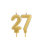 Golden number 27 birthday candle on white background