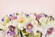 Blossoming white and light yellow daffodils, pink hyacinths and spring flowers festive background, bright springtime bouquet floral card, selective focus, shallow DOF	
