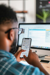 Web Developer Strategizing with a Mobile Phone for Website and App Development