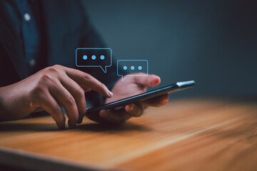 Leinwandbilder - Businessman using smartphone typing Live chat chatting and social network concepts, chatting conversation working at home in chat box icons pop up. Social media marketing technology concept.