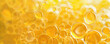 Yellow color oil bubbles background. Closeup view.