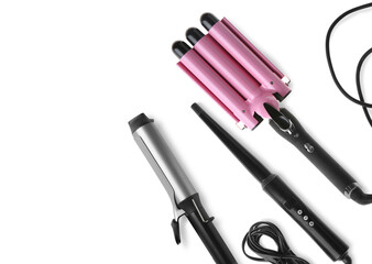 Canvas Print - Different hair curling irons on white background, top view