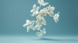 © buraratn - Jasmine bloom. A beautifull white flower of Jasmine falling in the air isolated on blue background. Levitation or zero gravity concept. High resolution image.