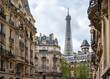 Eiffel Tower behind residential buildings in Paris, France