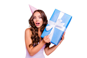 Poster - Close up portrait of attractive, pretty, dreamy, astonished wondered cute lovely beautiful lady with big blue bonus or gift in hands isolated on shine pink background with wide open mouth and big eyes