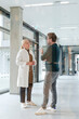 © Westend61 - Mature man discussing with doctor in hospital corridor