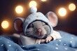 Baby mouse in blue pajamas and a cute hat with a pompom sleeps sweetly in a bed 