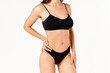 © GVS - Perfect sporty body in black underwear of young woman