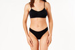 © GVS - Perfect sporty body in black underwear of young woman