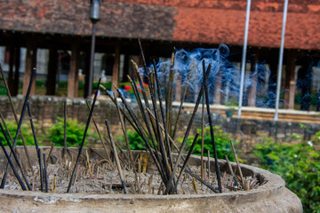 Wall Mural - Burning Incense at The Temple of the Sacred Tooth Relic, Kandy, Sri Lanka