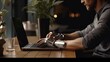 Close-up on Hands: Person with Disability Using Prosthetic Arm to Work on Laptop Computer. Specialist Swift and Natural Use of Thought Controlled Body Powered Myoelectric Bionic Hand