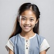 Close-up Studio Portrait of an 11-year-old Vietnamese Girl with Shy Smile