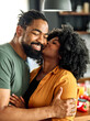 © Lumos sp - woman man couple happy together hug bonding talking dating  leisure fun smiling love young home kitchen two girlfriend boyfriend date wife relationship african american romance kiss kissing