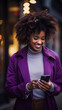 © c_ART_oons - a beautiful black woman in a violet coat holding a smartphone. woman texting on cell phone