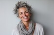 © Loli - Portrait of a happy mature woman with grey hair and gray scarf