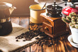 Cup Of Coffee, beans roating and Ingredients for making coffee and accessories on the table wooden background. Coffee making concept