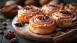 Freshly baked cinnamon rolls topped with nuts, set on a wooden surface, with warm bokeh lights in the background