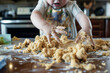 child with hands in cookie dough, kitchen in disarray