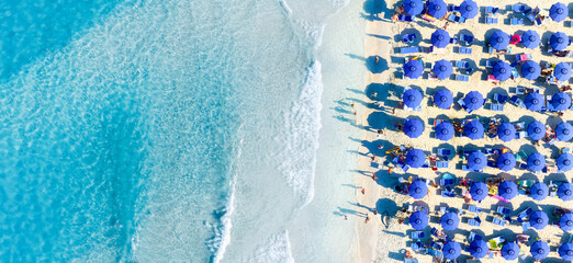 Wall Mural - aerial view on beach, people and umbrellas. vacation and adventure. mediterranean sea. top view from