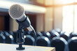 closeup of a microphone on a podium in a seminar room