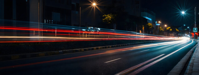 Wall Mural - City road at night, blurred vehicle lights creating a sense of motion and speed. 