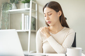 Wall Mural - Body muscles stiff problem, ache asian young woman, girl pain neck while sitting work on chair at home, holding massaging rubbing, hurt or sore, Healthcare people, office syndrome.