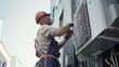 Professional Technician Servicing Air Conditioning Unit”