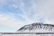 © Bruno_Almela - Northern landscapes: Hafnarfjall mountain stands under a vast sky, showcasing Iceland's dramatic winter scenery. (region of Vesturland, Iceland)